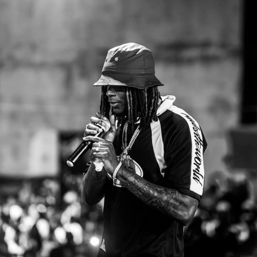 Black and white portrait of HIMRA with a microphone